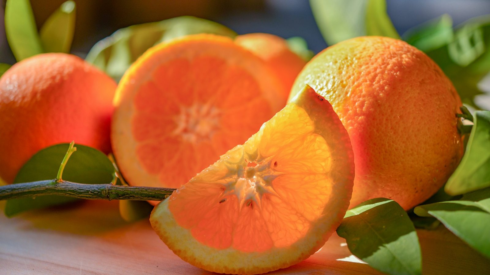 a group of oranges sitting on top of a table