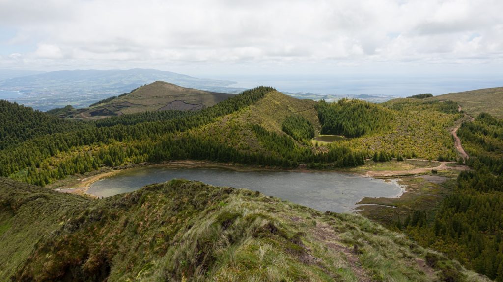 a view of a lake in the middle of a mountain range