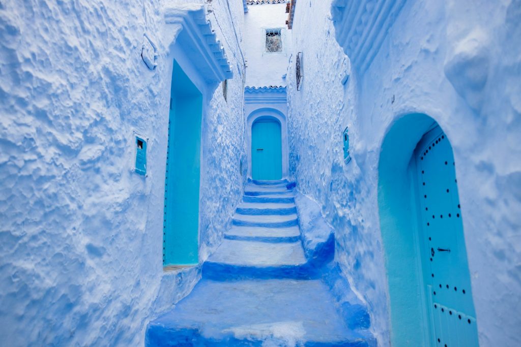 a narrow alley way with blue painted steps. 9 Hidden Gem Destinations You Absolutely Can’t Miss