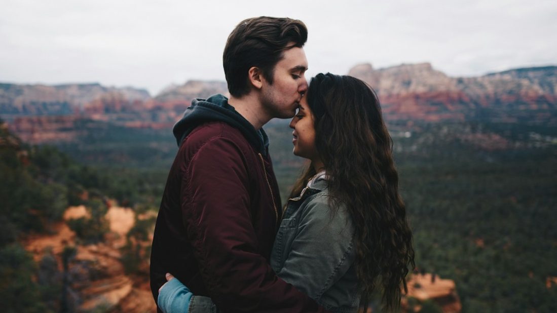 man kissing woman's forehead. 10 Shocking Red Flags You Should Never Ignore in a Partner