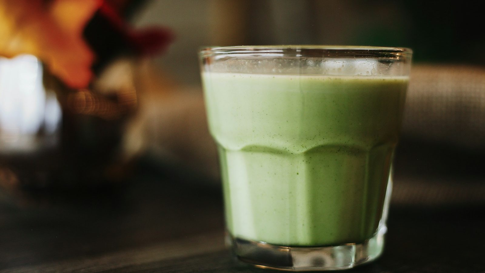 green liquid in clear drinking glass. 7 Life-Changing Healthy Smoothie Recipes