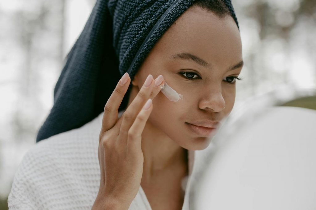 Woman Wearing Bathrobe Putting Facial Cream, 5 Life-Changing Skincare Tips for Flawless Skin