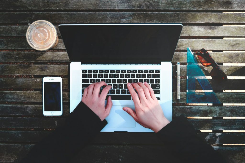 flat-lay photography of person about to use laptop computer, 5 Essential Leadership Skills Every Business Owner Needs