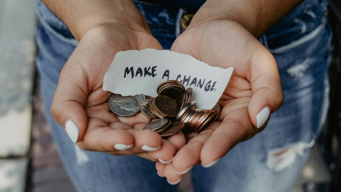 person showing both hands with make a change note and coins, 10 Worst Money Traps You Must Avoid