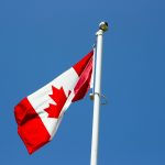 flag of Canada under blue sky at daytime