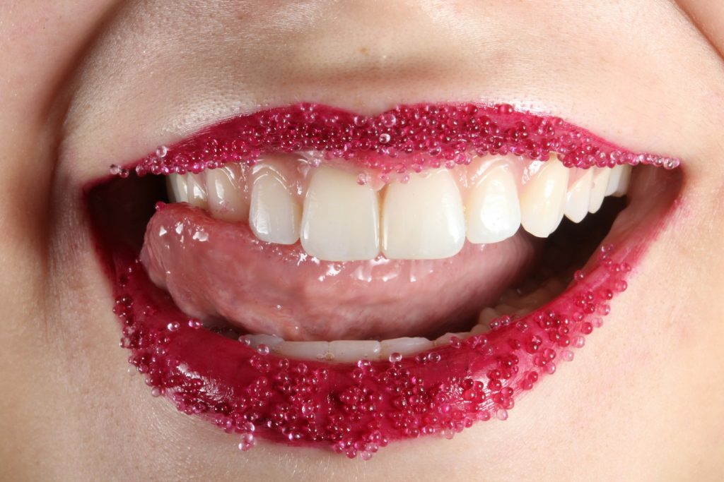 person with red lipstick and white teeth, 7 Best Beauty Hacks You’ve Never Heard Of