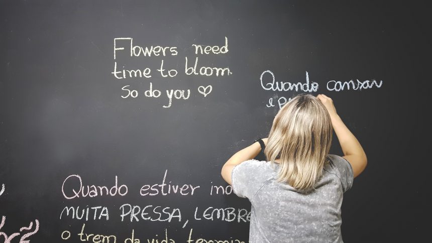 unknown person writing on chalkboard Languages