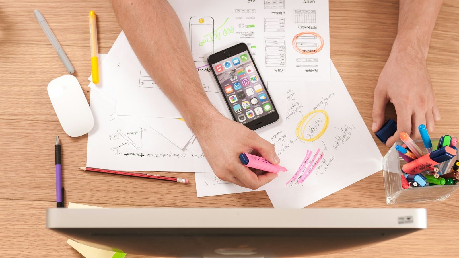 person writing on white paper Hyperlocal Content Local SEO Basics