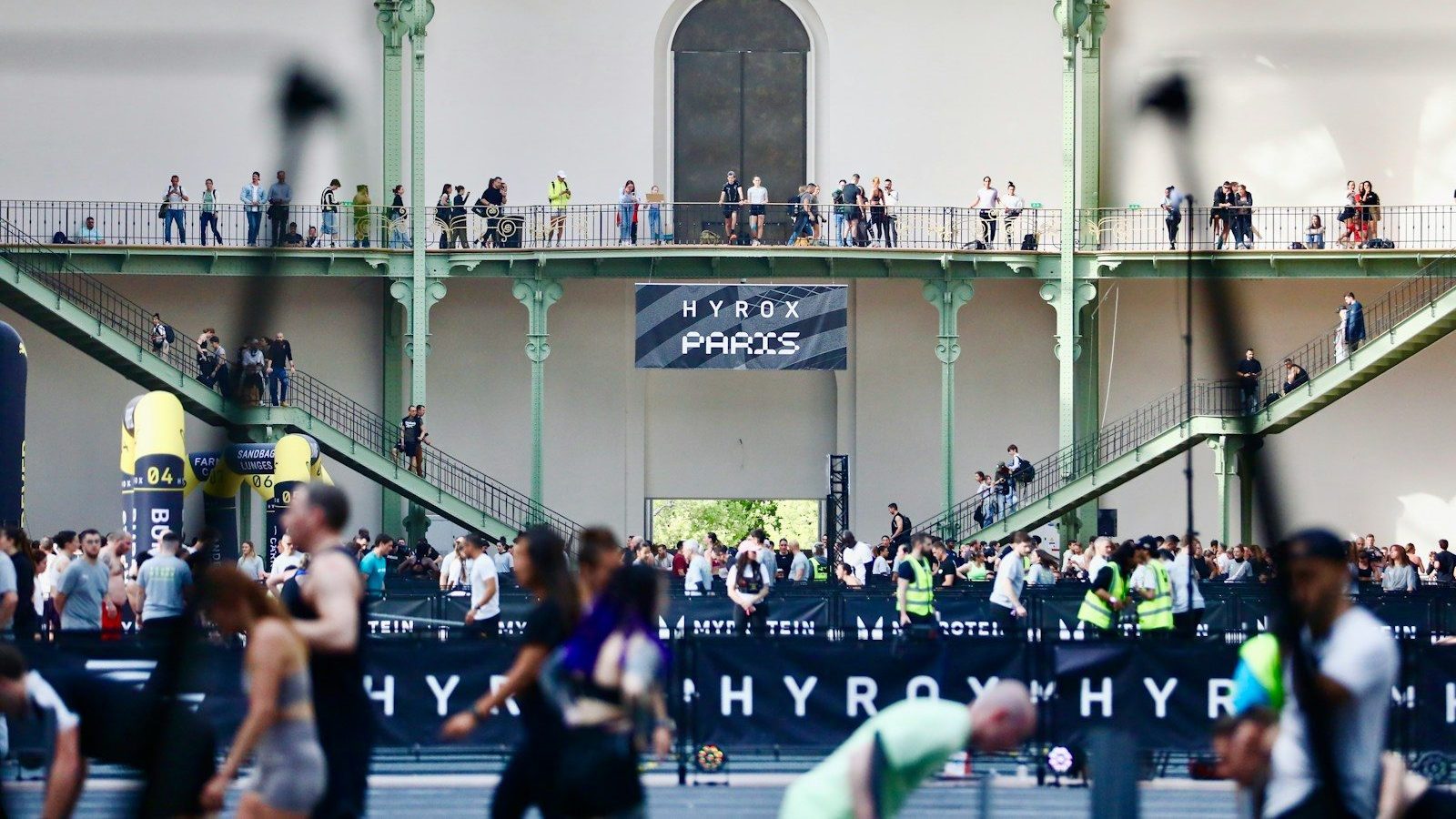 People gathered inside a large building with balconies. Hypothesize Testing Everything