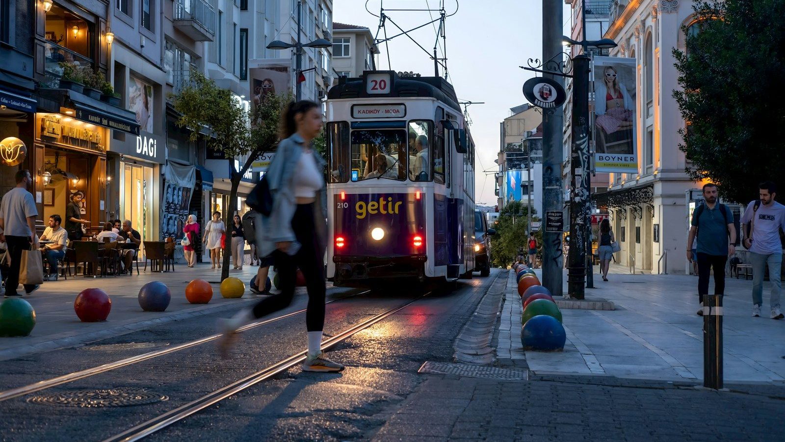 A trolley is coming down the street at dusk Dynamic Elements Testing Everything
