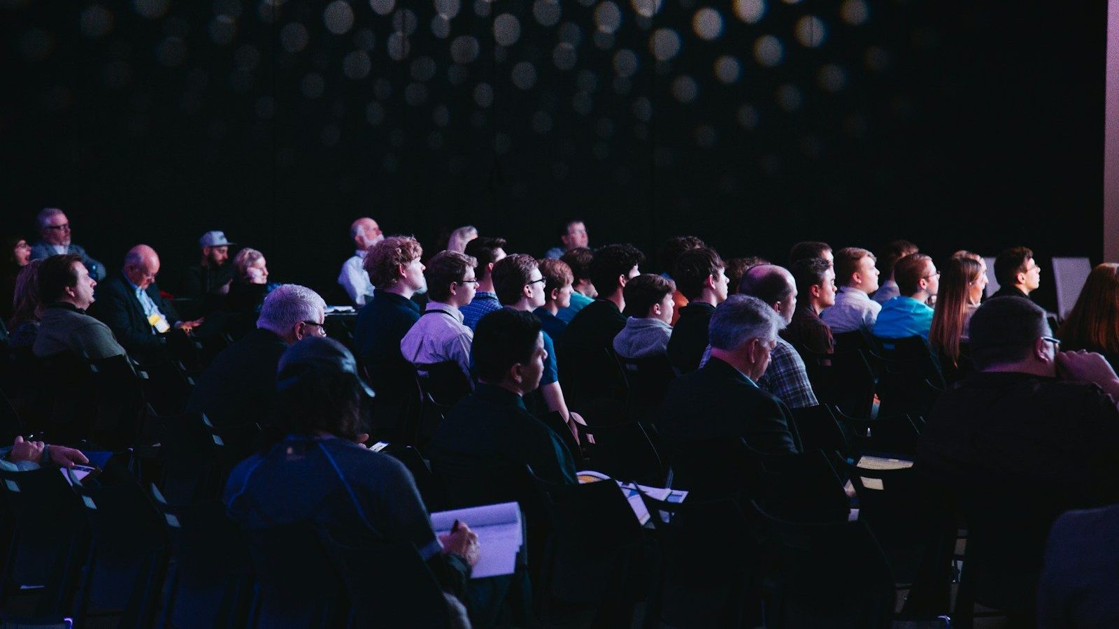 crowd of people sitting on chairs inside room Investor Meetings Attracting Angel Investors