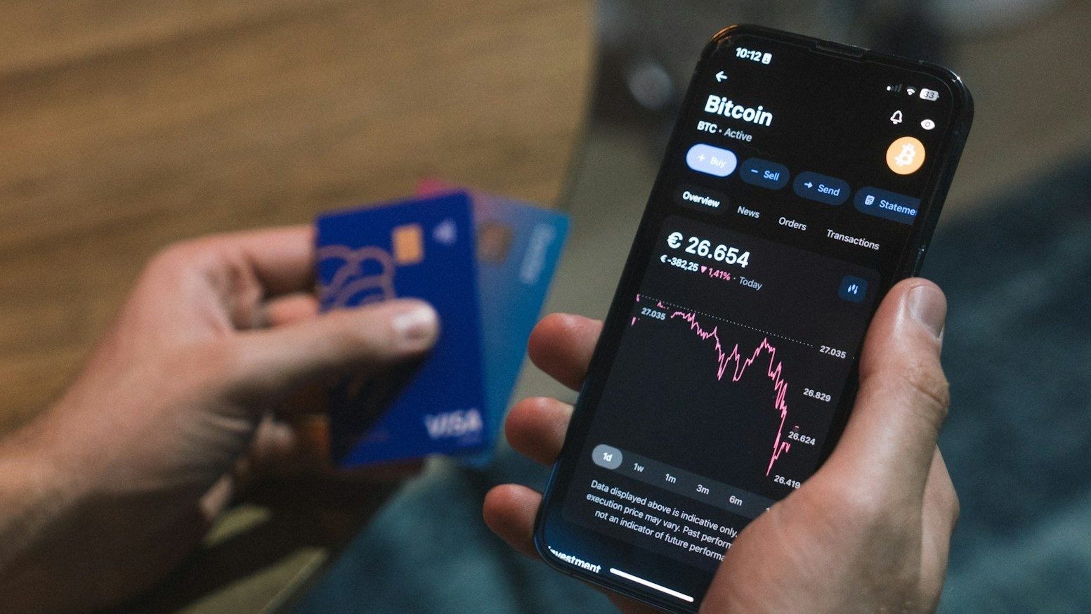 a person holding a cell phone in their hand Business Credit Credit Score for Business Owners