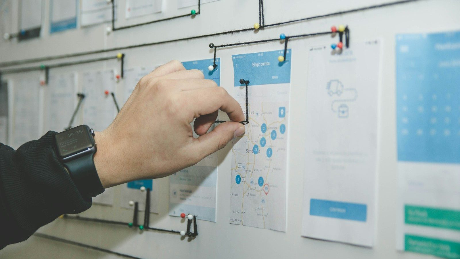 person working on blue and white paper on board Inventory Management Seasonal Industries