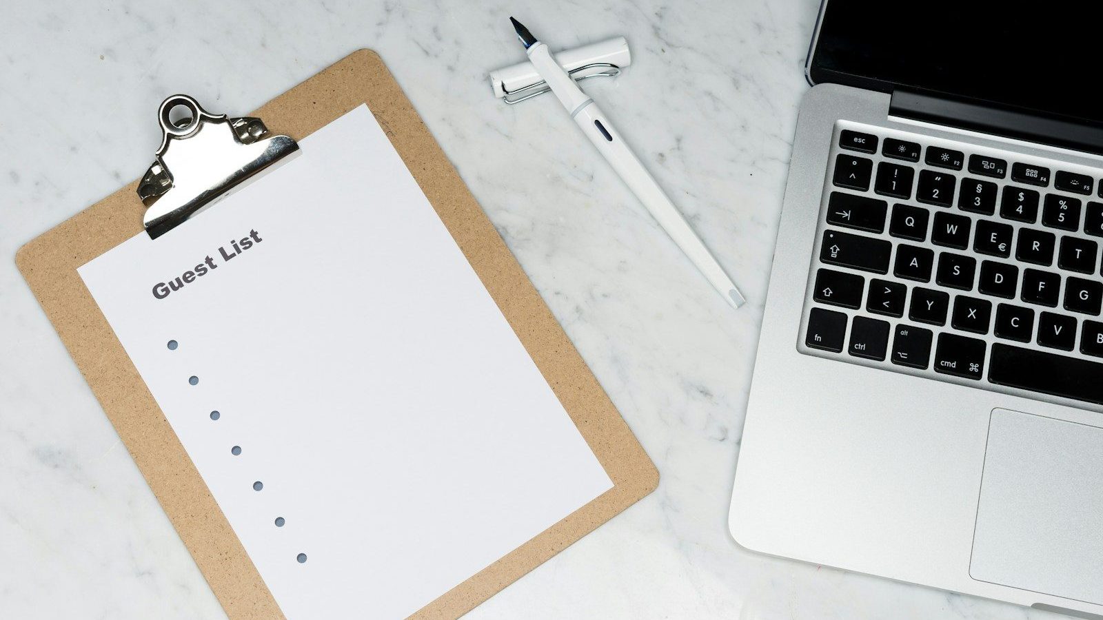 white paper on silver laptop computer Grant Success Leveraging Grants