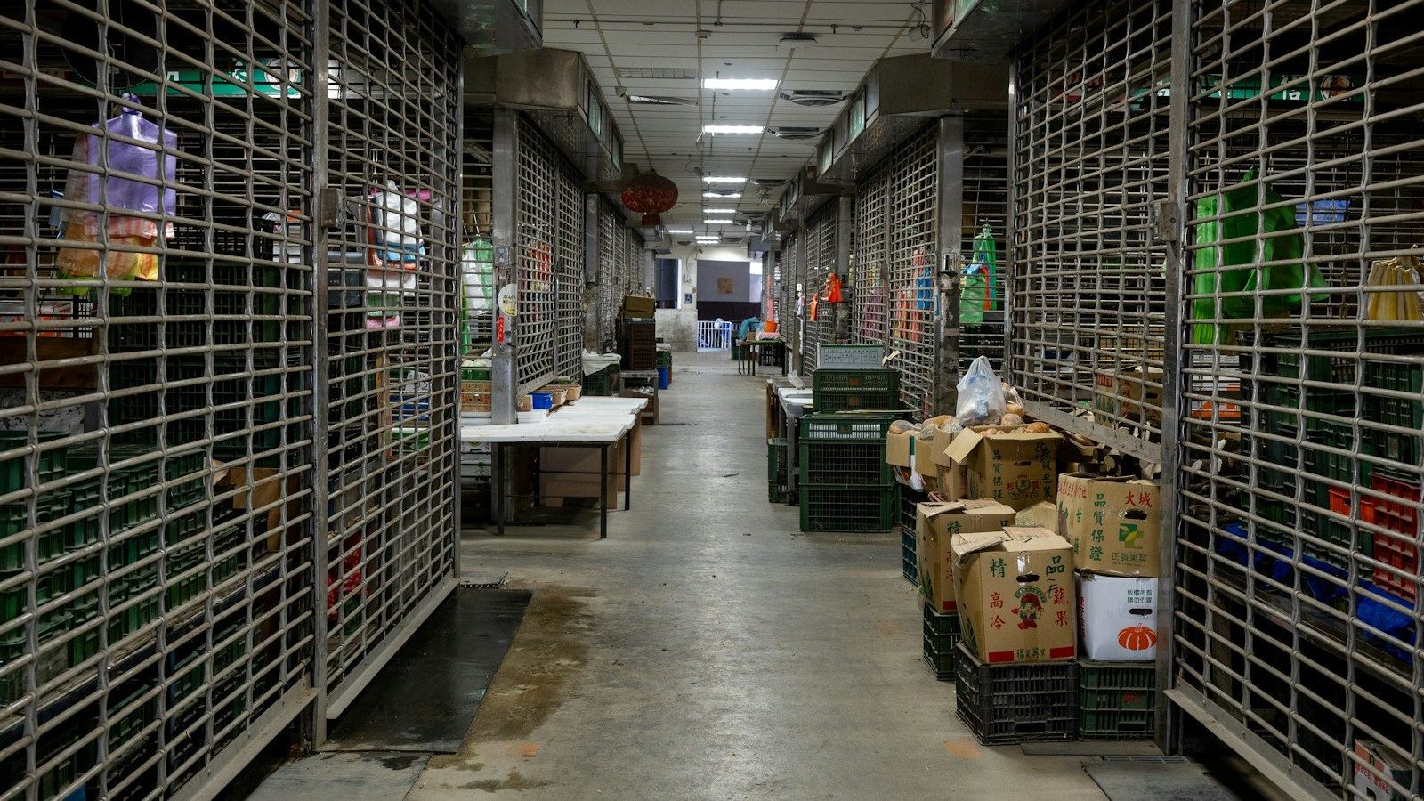 Closed market stalls with metal security shutters and boxes Empty Space Sustainable Packaging