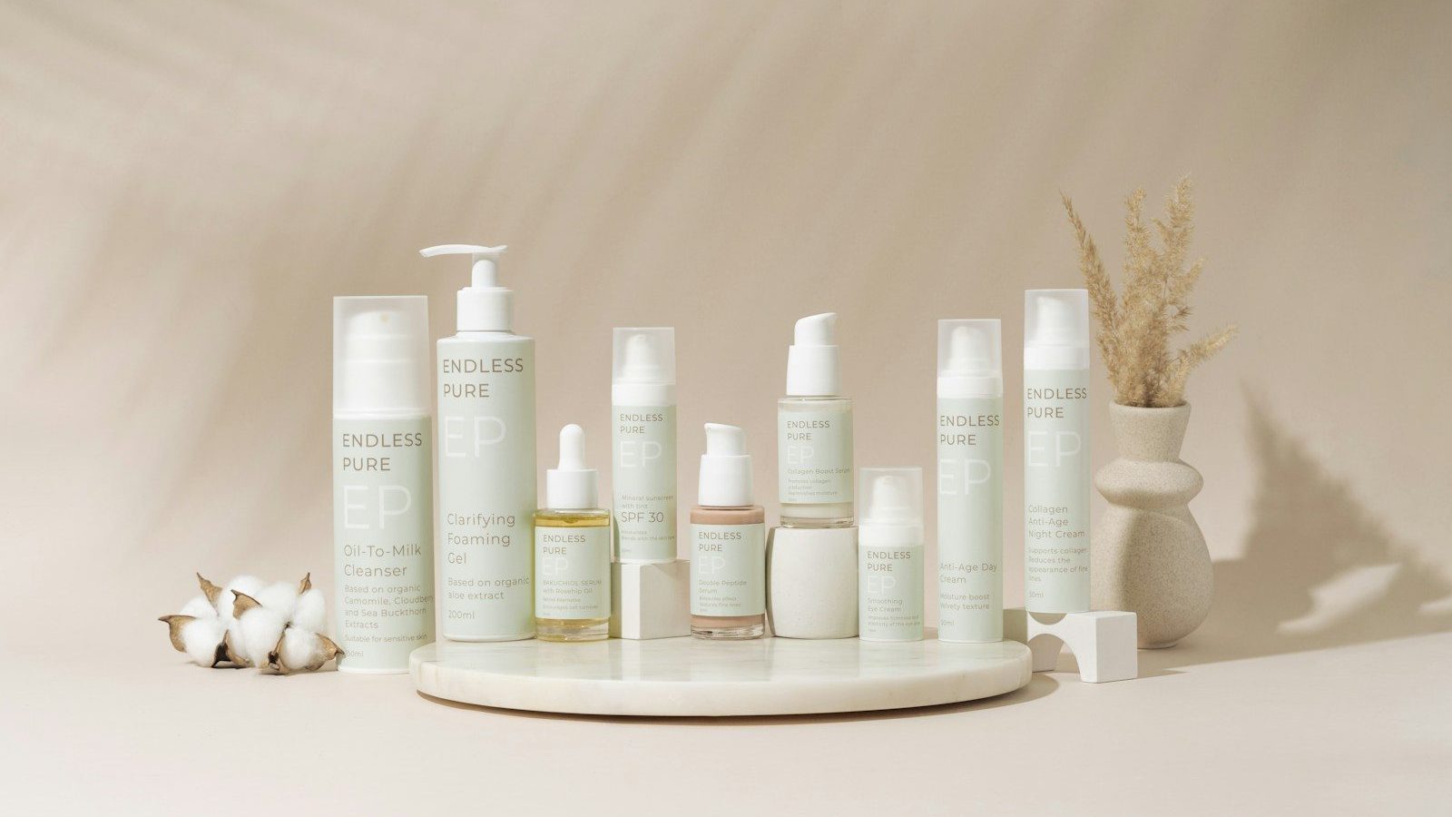 A group of bottles of lotion sitting on top of a table Product Protection Sustainable Packaging