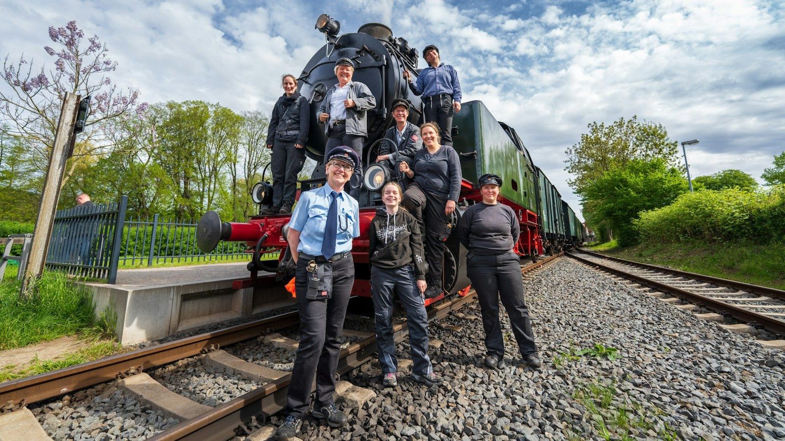 a group of people standing in front of a train Packing and Shipping Tips