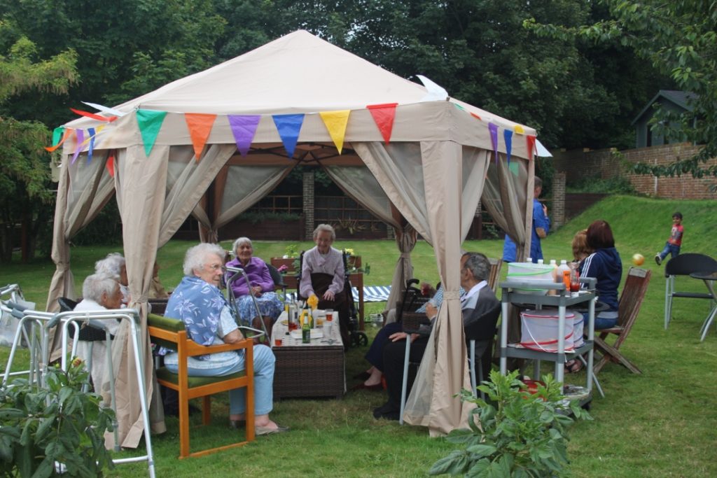 Residents in gazebo at St Marguerite Care Home