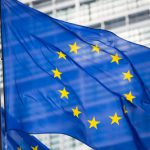 EU flag in front of Berlaymont building facade