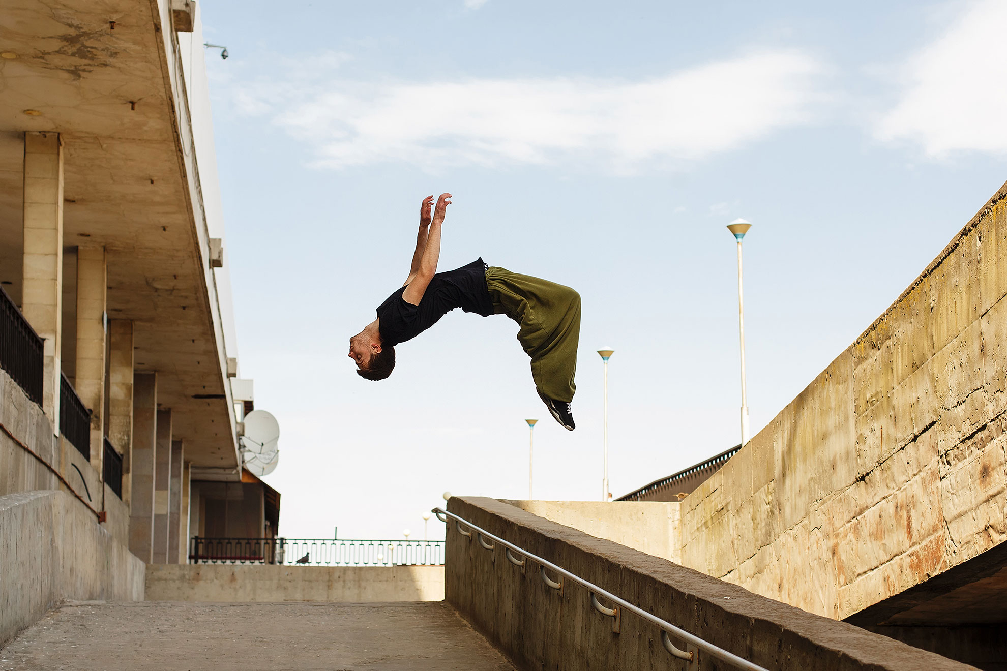 Parkour in the city of copenhagen. Man doing parkour backflips