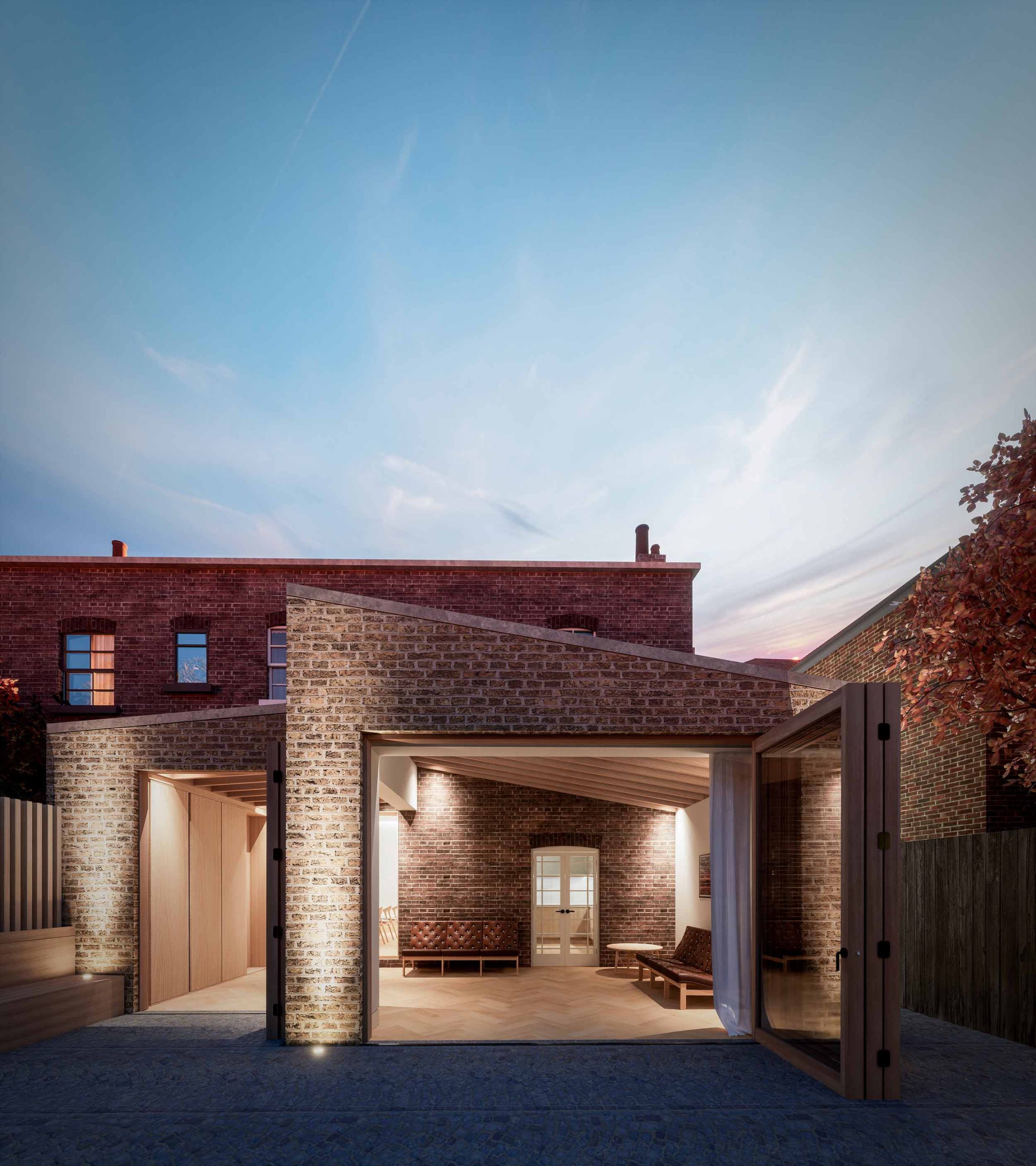 rear extension with timber doors double pitch roof buff brick retrofit heritage conservation dusk