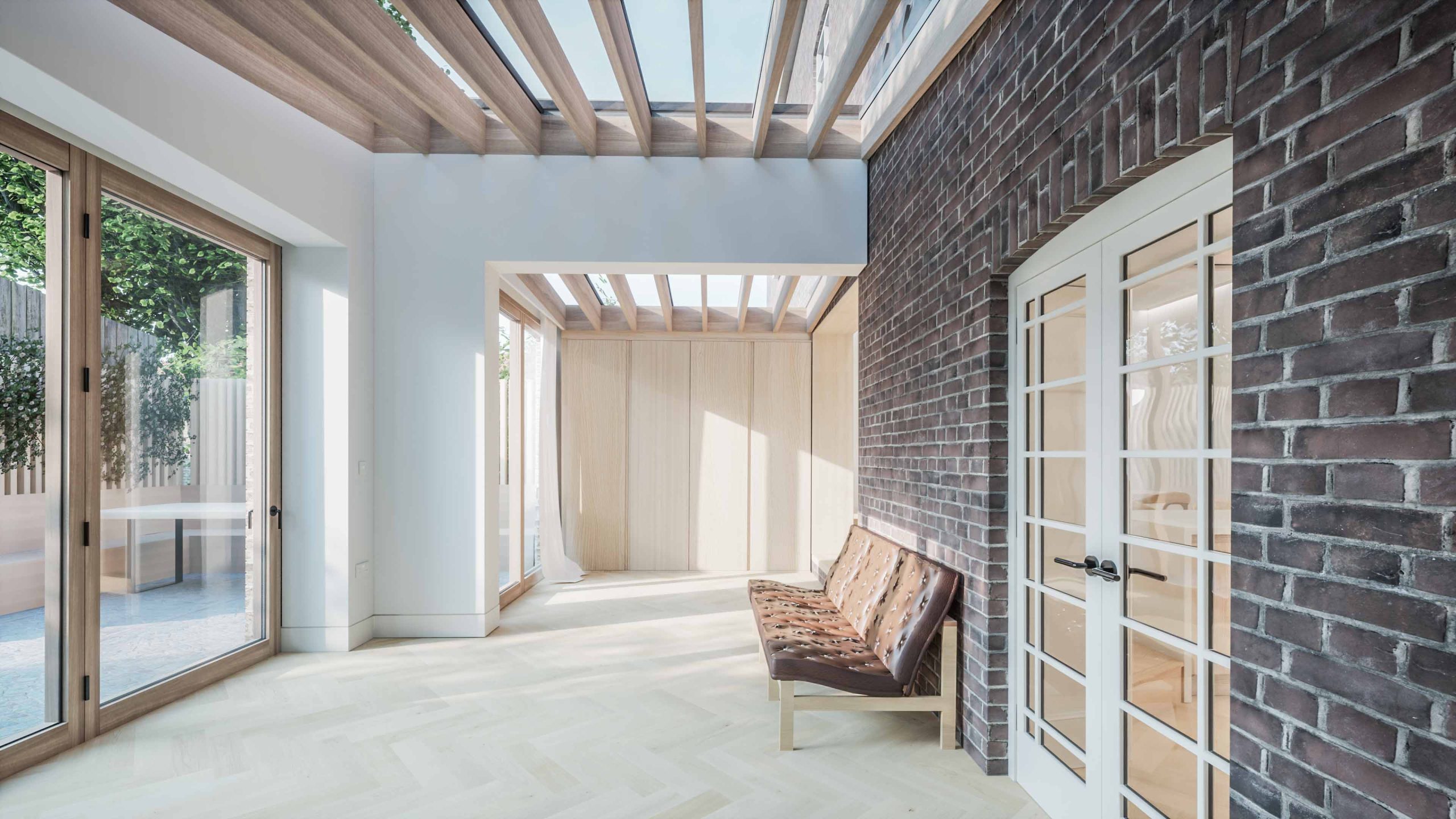 rear extension with timber doors, double pitch roof, exposed brick snug