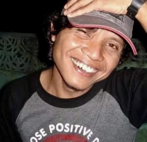 Indonesian man looking at the camera and smiling