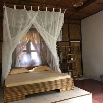 jungle hotel room with a double bed