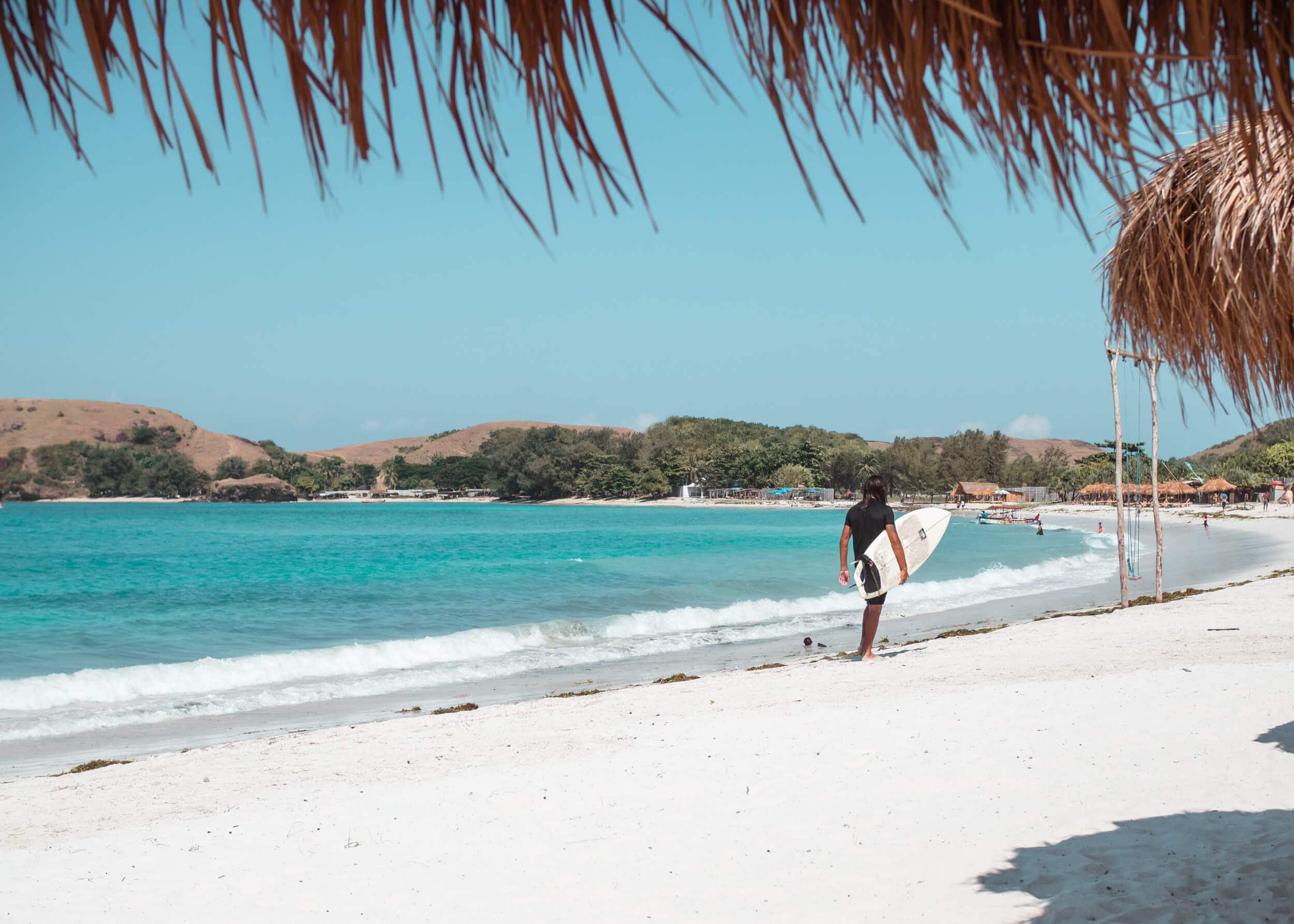 Surfer on Tanjung Aan, the best beach in Lombok