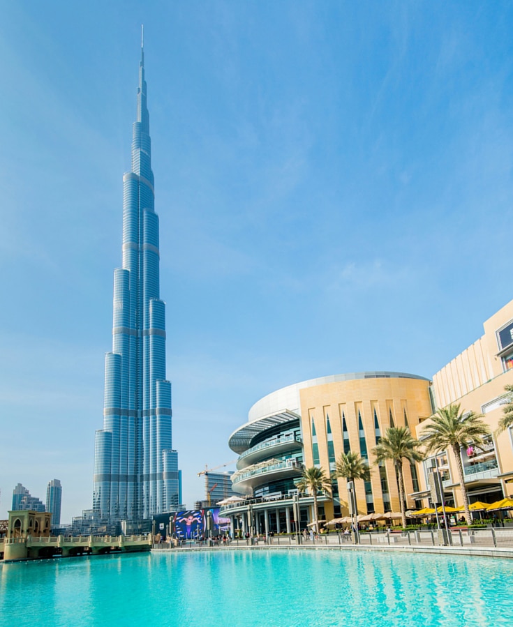 Burj Khalifa towering above a turquoise pool, a must during your two days in Dubai