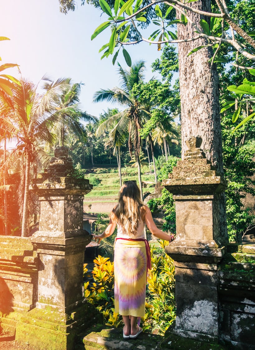 Exploring Pura Gunung Kawi wearing a pink and yellow sarong - My favorite temple in Ubud