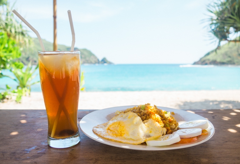 Nasi Gorend and lemon iced tea for lunch at Mawun Beach, one of the best places to eat in Kuta Lombok.