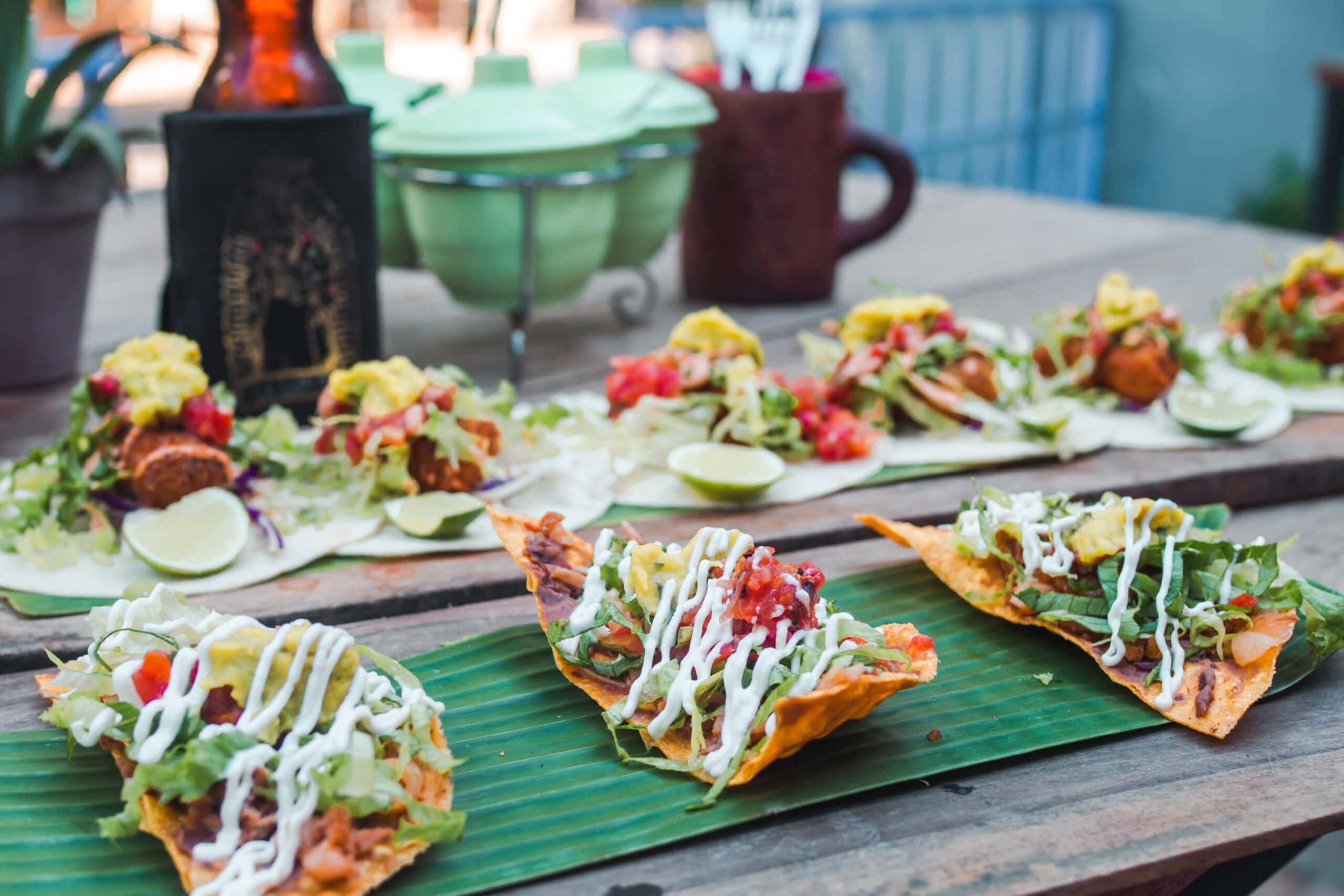 Tostadas and tacos served on palm leaf on wooden planks, at Cantina Mexicana, one of the best restaurants in Lombok.
