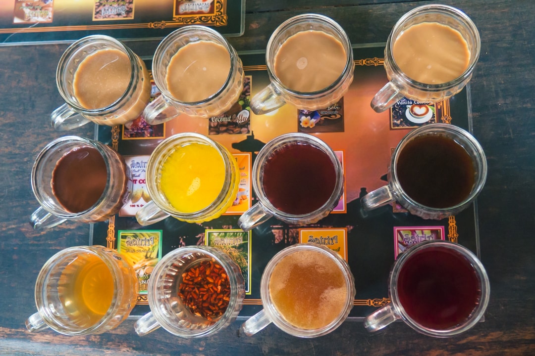 12 different tea and coffee tasting options seen from above, the second stop on our cycling tour in Bali.