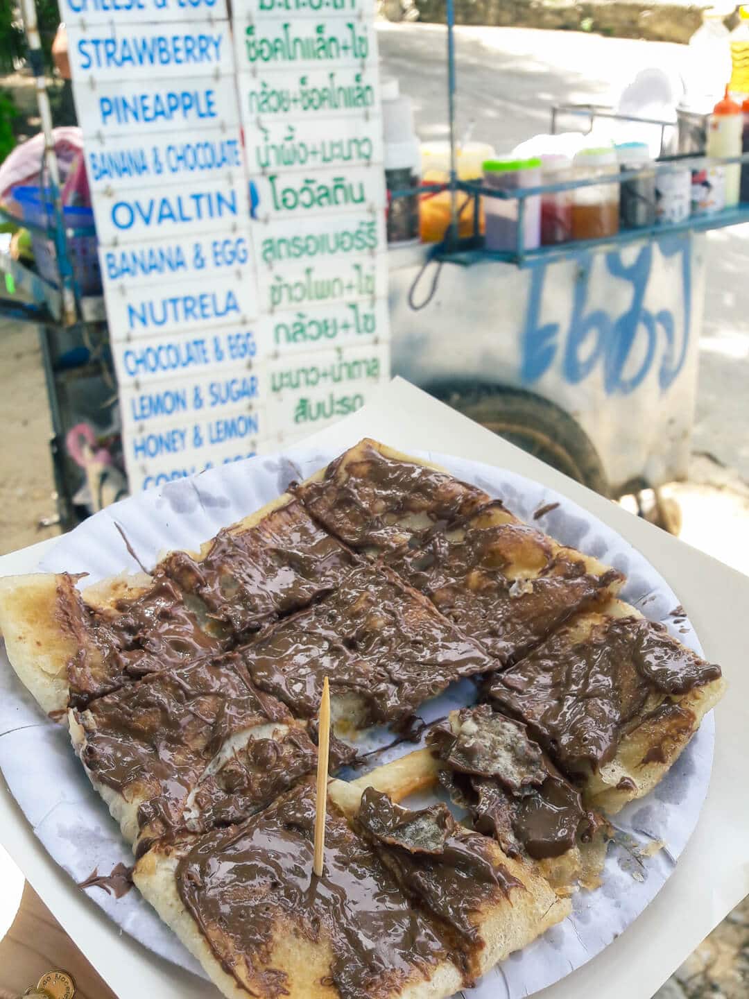 Nutella Roti with the vendor sign in the background on Lung Dum Beach on Koh Samet.
