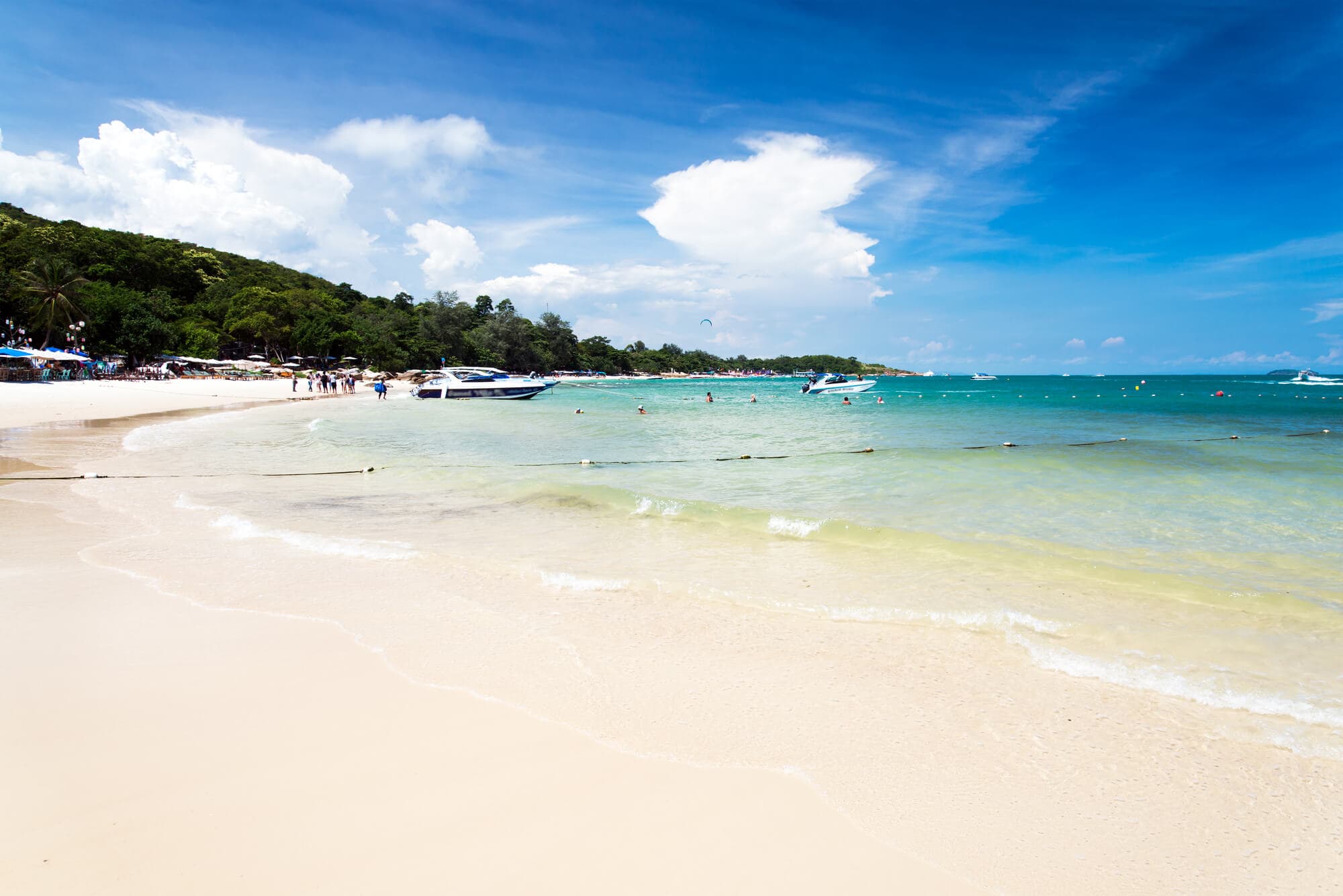 View of the white sand and turquoise water at Sai Kaew, the main Beach on Koh Samet in Thailand.