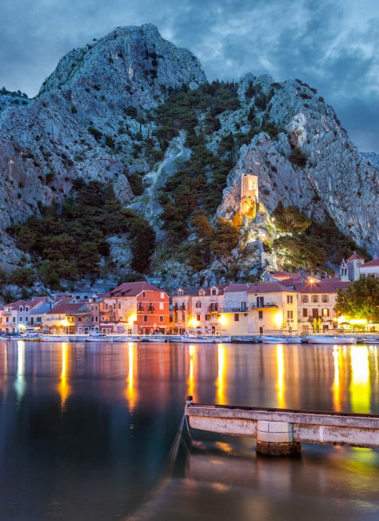 Lights reflecting in the ocean in Omis, Croatia