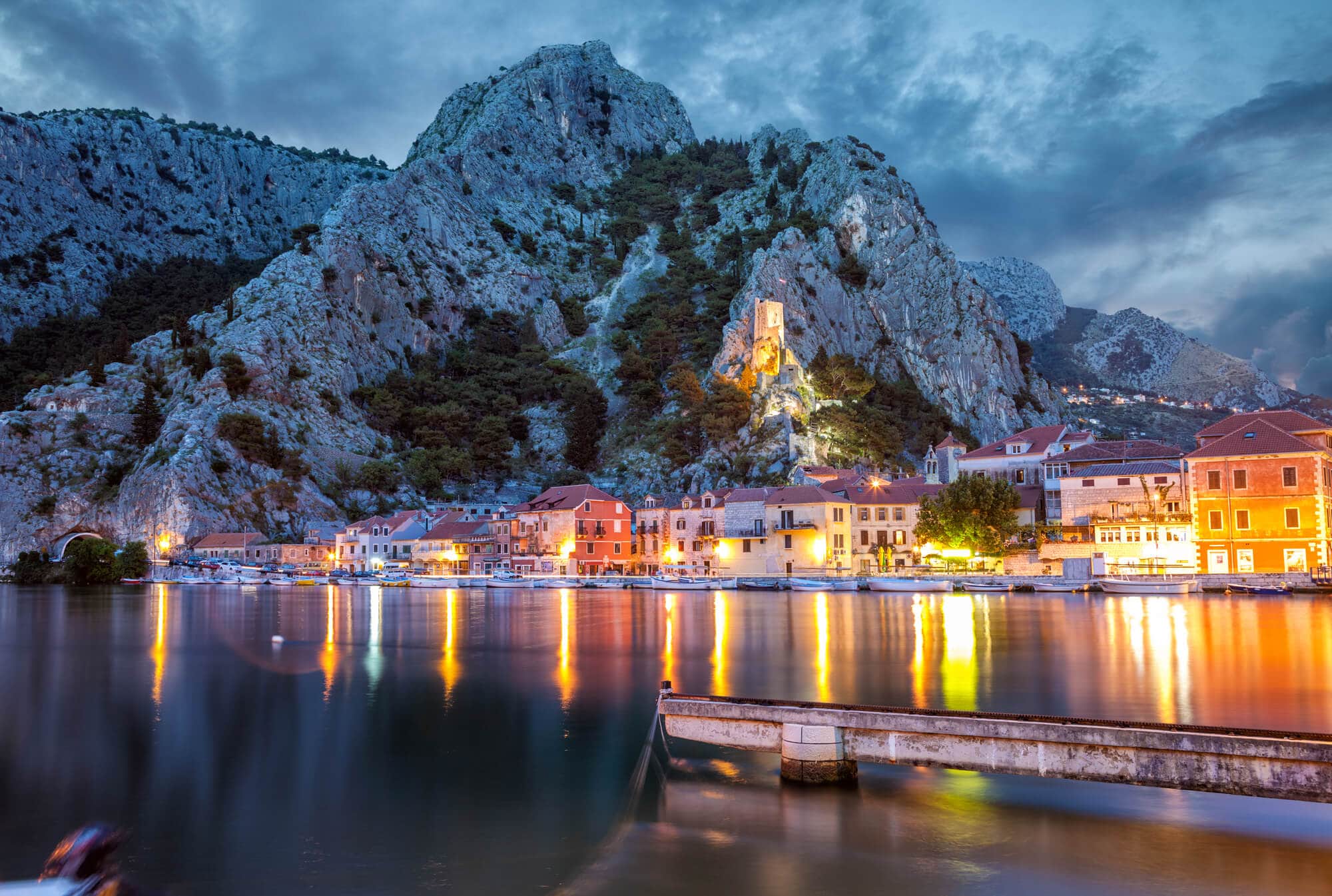 Lights reflecting in the ocean in Omis, Croatia