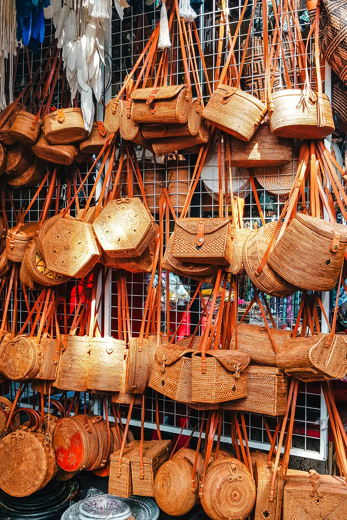 A wall of brown rattan bags at Ubud Art Market, one of the best markets in Bali.