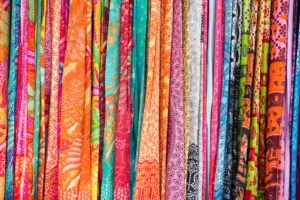 A stack of colorful sarongs at Ubud Art Market, one of the most popular markets in Bali.