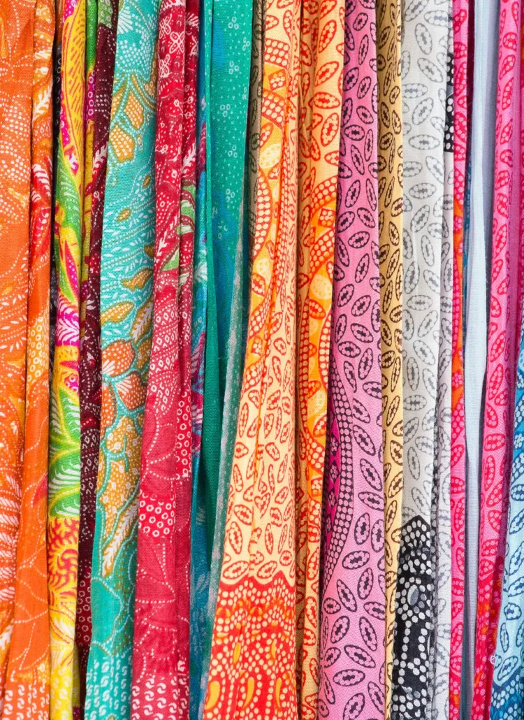 A stack of colorful sarongs at Ubud Art Market, one of the most popular markets in Bali.