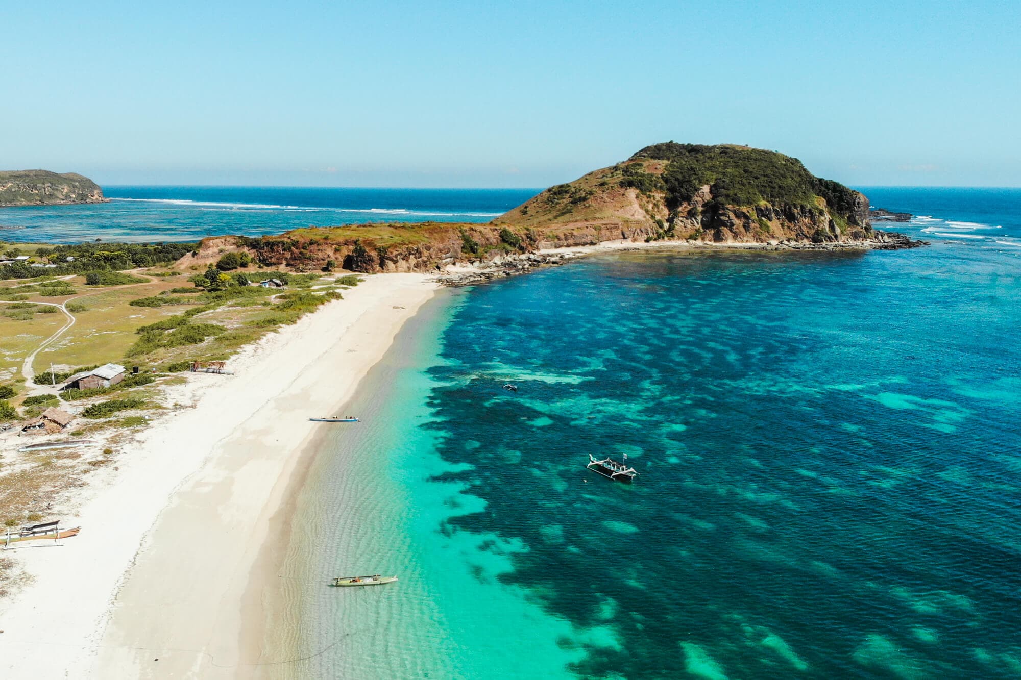 Follow along on our journey living in Kuta, Lombok for months - Drone shot of Tanjung Aan Beach.