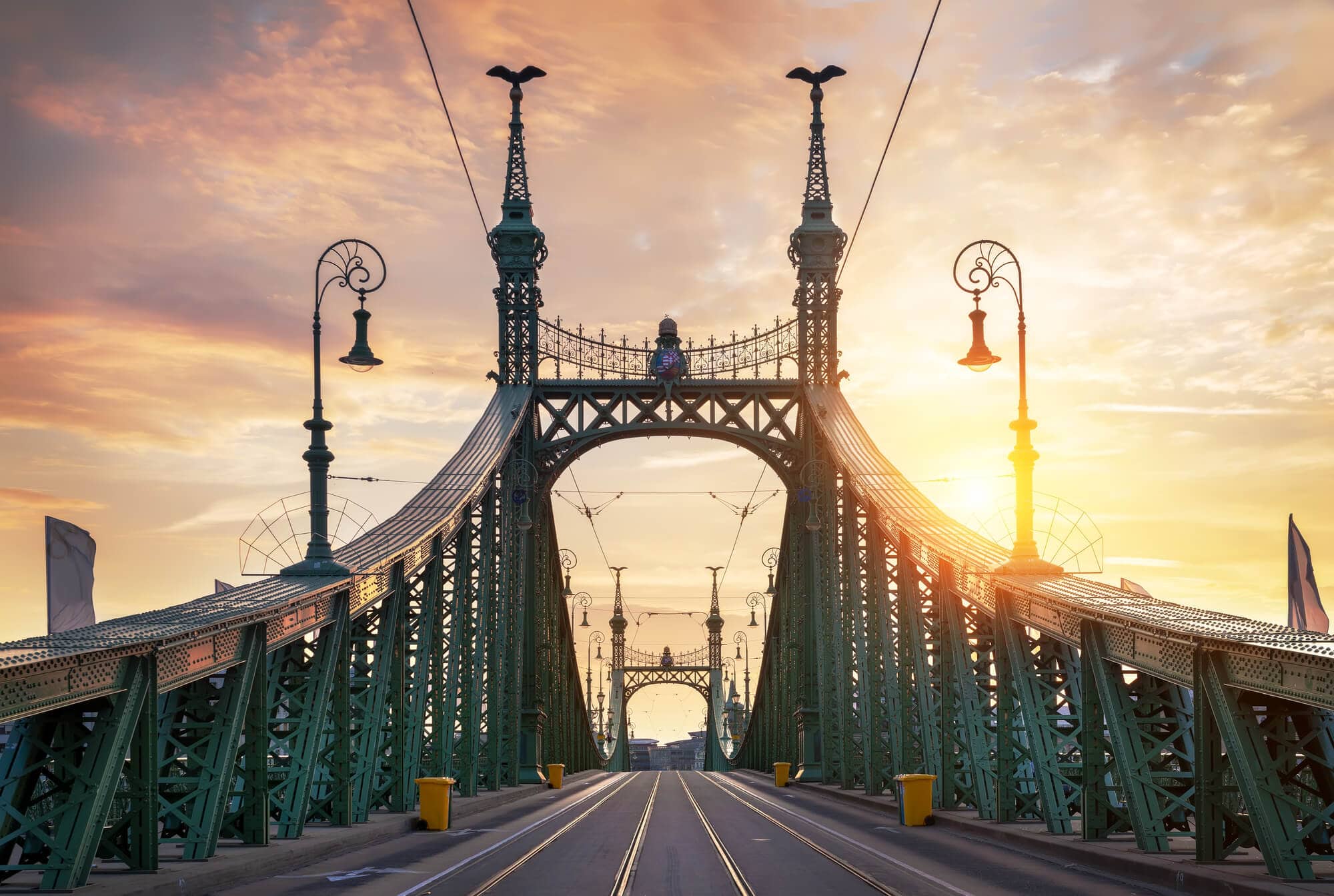 Guide to the best Budapest Instagram spots - The green  intricate Liberty Bridge at sunset