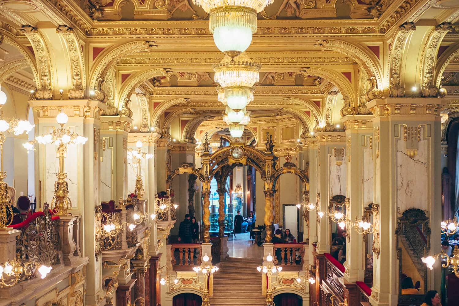 Inside the famous old world New York Café in Budapest, decorated with chandeliers, red velvet and gold leaf. 