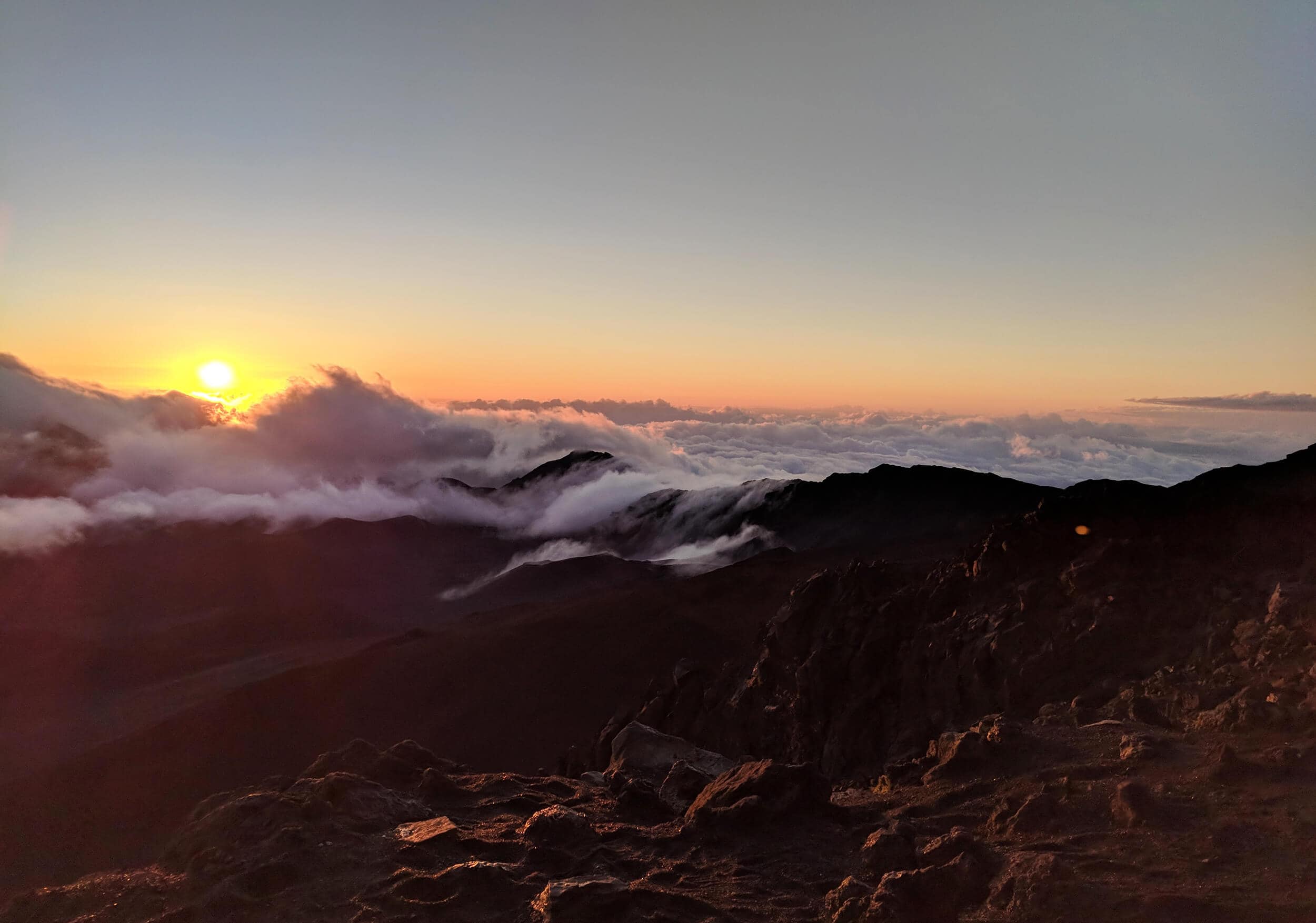 Travel bloggers reveal their most unforgettable travel experiences - Sunrise over Haleakala Volcano on Maui in Hawaii