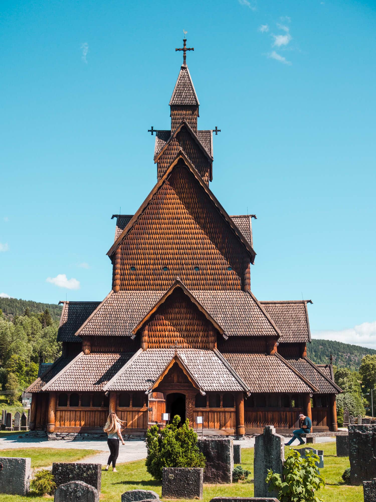 Norway fun fact, Heddal Stave Church is the largest stave church in Norway, built from warm wood looking almost golden against the blue sky.