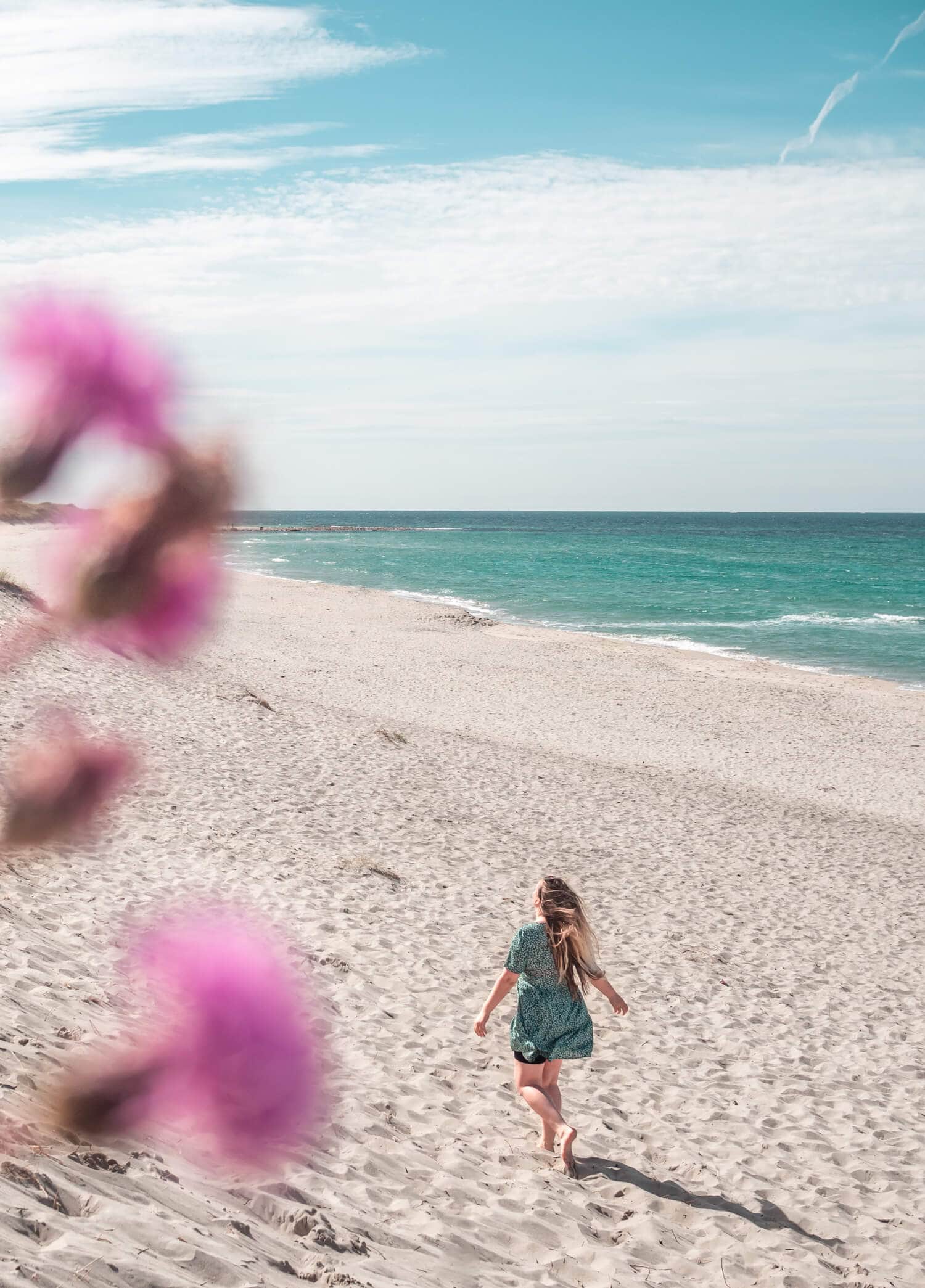 Girl running on the beautiful Orrestranda beach on the Jæren coast just south of Stavanger