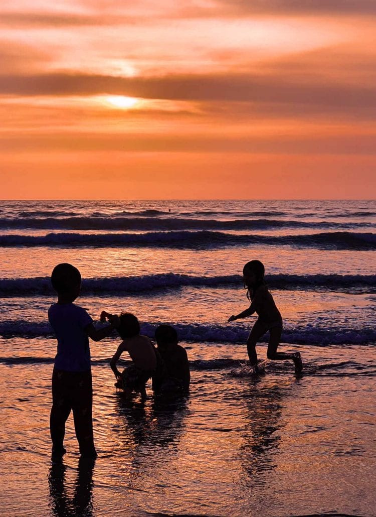 Children playing on Kuta Beach - The dark side of Bali