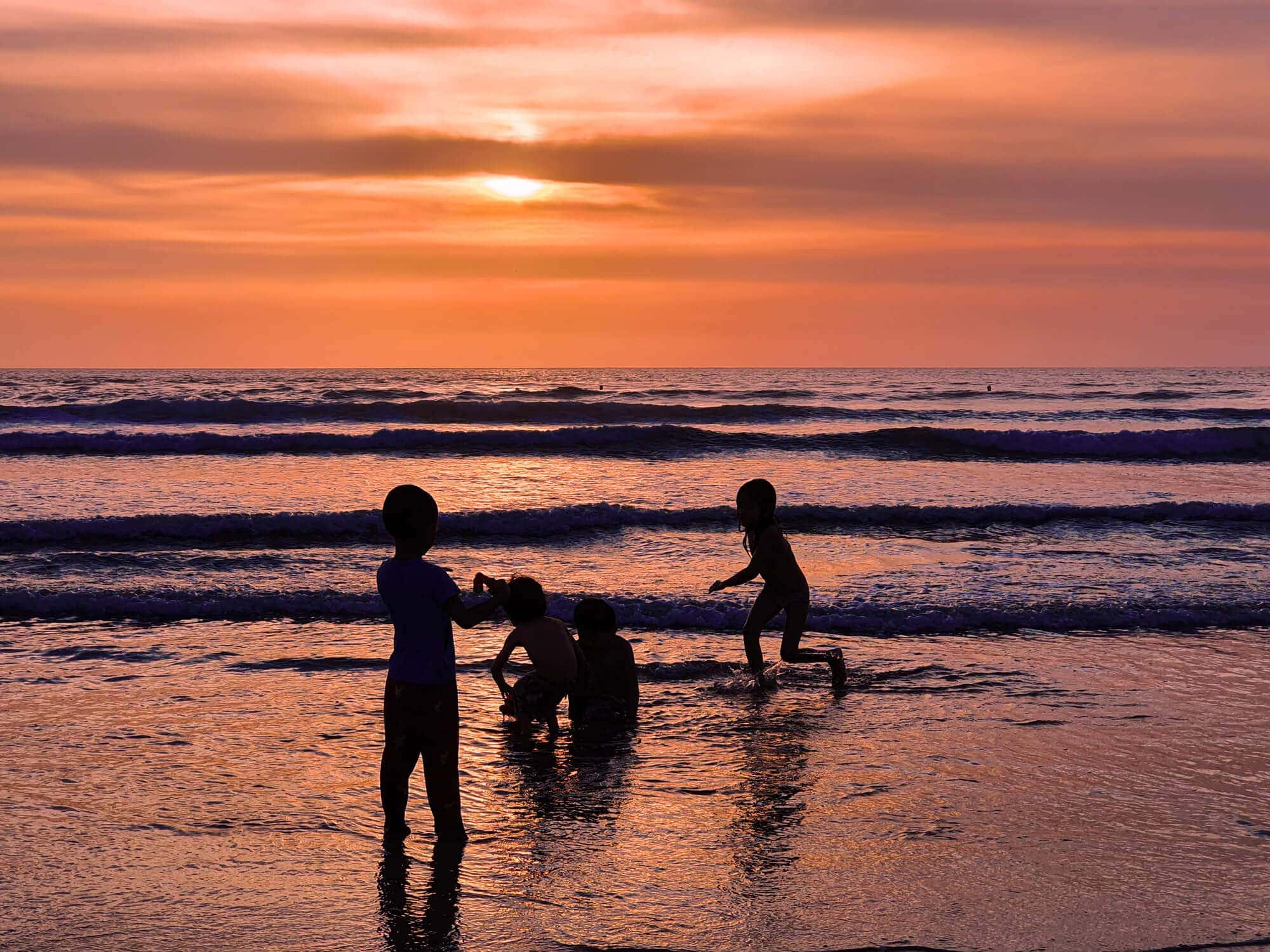 Children playing on Kuta Beach - The dark side of Bali
