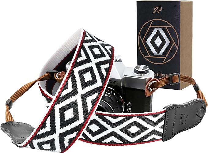 Black and white pattern camera straps with beige leather on the ends, the perfect travel gifts under $50 for him and her.